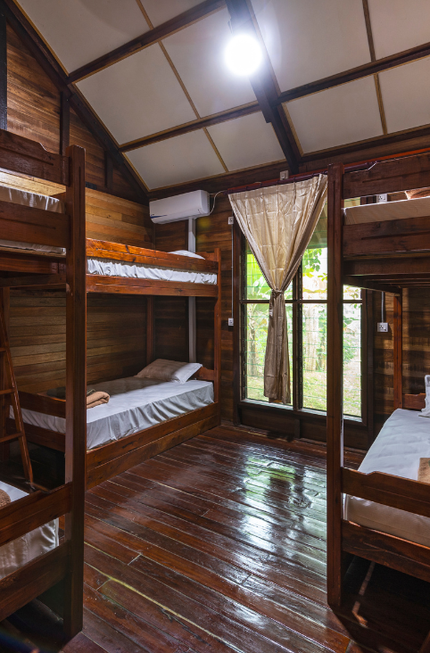 Luxury wooden dormitory with air conditioning at borneo sepilok rainforest resort