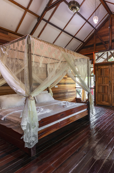 double bed in the chalet of borneo sepilok rainforest resort